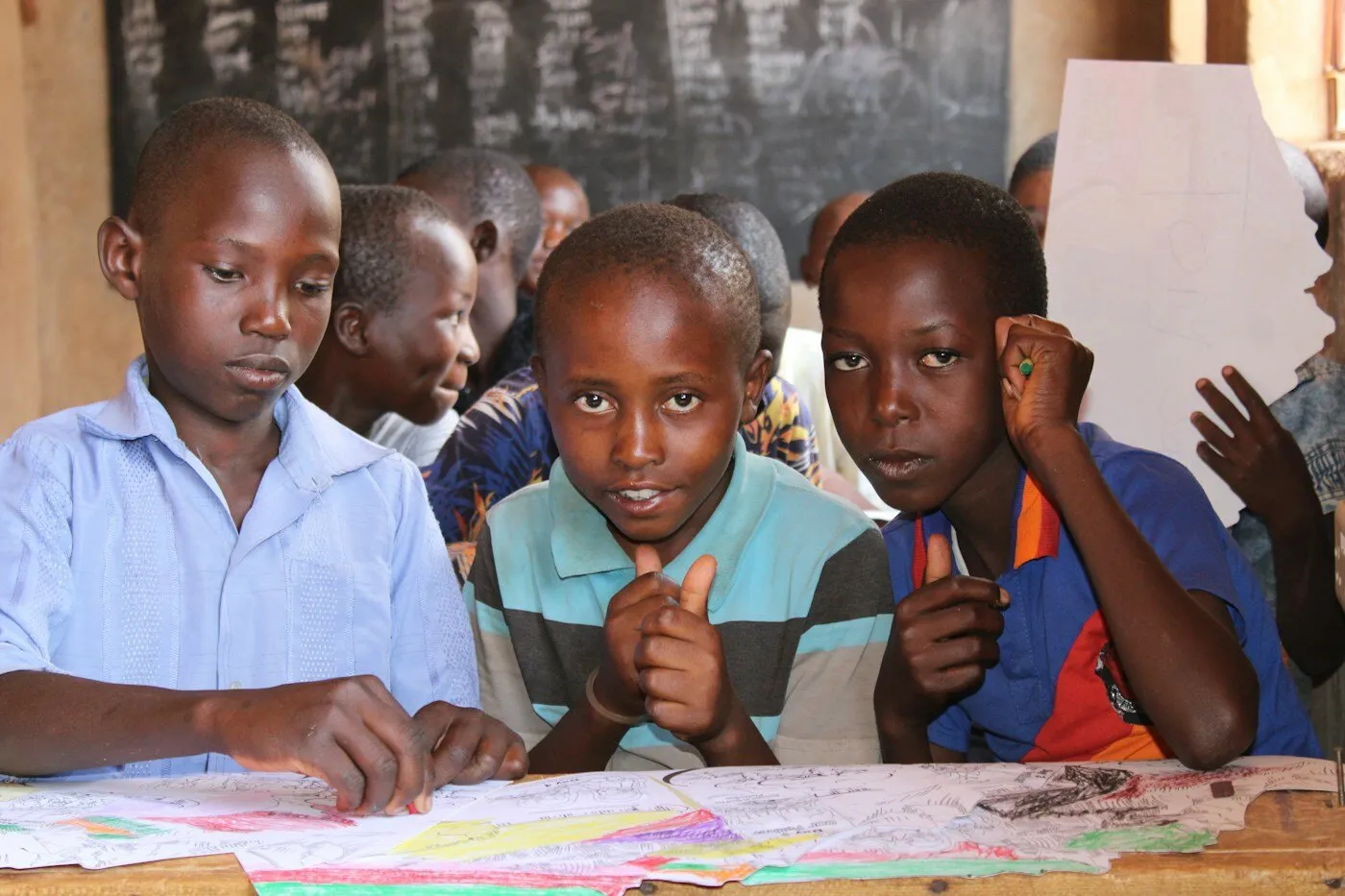 African children at a table in a Kenyan classroom