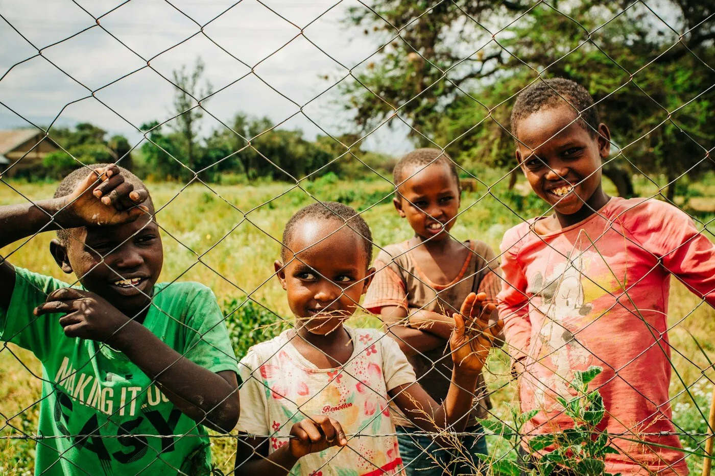 African children standing near trees in Kenya