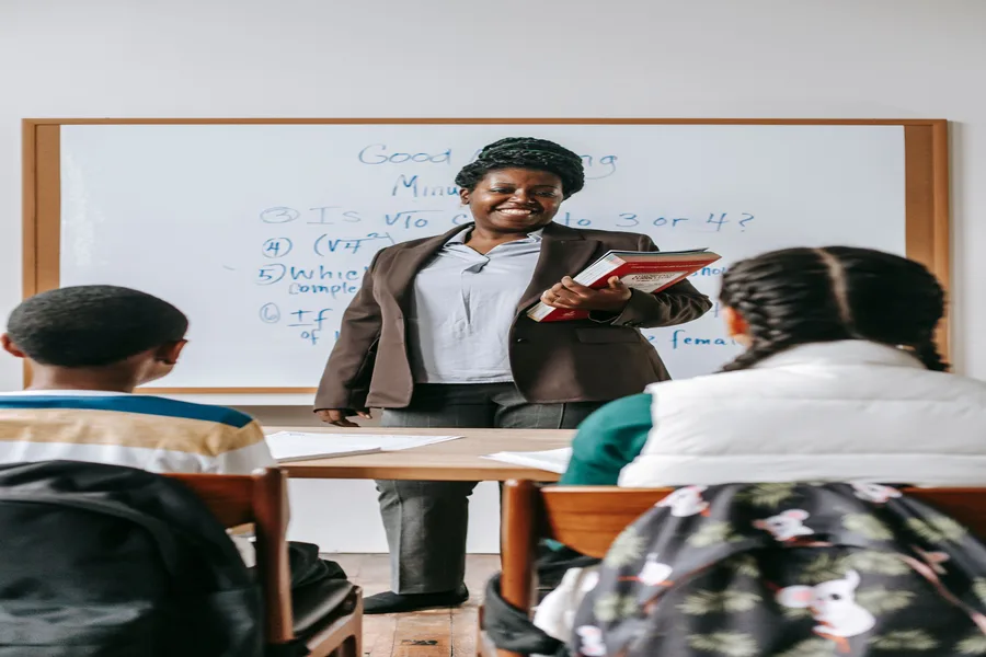 Teacher engaging with students in a Kenyan classroom