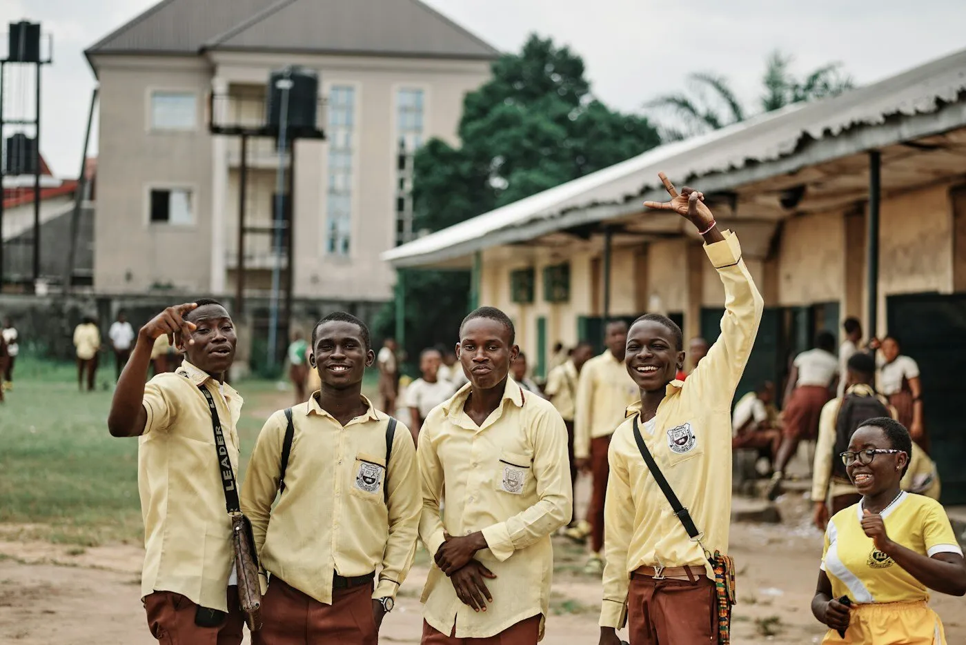Group of young African men in school uniforms standing together